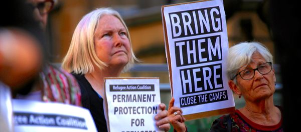 Refugee advocates hold placards and banners during a protest in central Sydney, Australia, October 5, 2016 Refugee advocates hold placards and banners during a protest in central Sydney, Australia, October 5, 2016 - Sputnik International