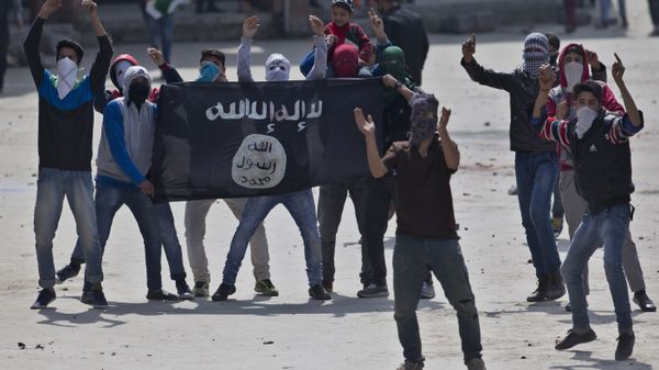 Kashmiri Muslim protesters hold a flag of Islamic State as they shout anti-India slogans during a protest in Srinagar, Indian controlled Kashmir, Friday, April 8, 2016 - Sputnik International