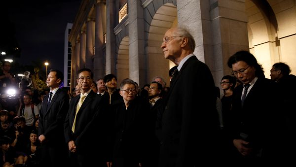 Legislator and barrister Dennis Kwok (L) and Former legislator Martin Lee (2nd-L) wearing black stage a silent protest to the Court of Final Appeal against China's parliament passed an interpretation of Basic Law, in Hong Kong, China November 8, 2016 Legislator and barrister Dennis Kwok (L) and Former legislator Martin Lee (2nd-L) wearing black stage a silent protest to the Court of Final Appeal against China's parliament passed an interpretation of Basic Law, in Hong Kong, China November 8, 2016 - Sputnik International