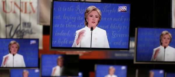 Democratic US presidential nominee Hillary Clinton is shown on TV monitors in the media filing room on the campus of University of Nevada, Las Vegas, during the last 2016 US presidential debate in Las Vegas, US., October 19, 2016. Democratic US presidential nominee Hillary Clinton is shown on TV monitors in the media filing room on the campus of University of Nevada, Las Vegas, during the last 2016 US presidential debate in Las Vegas, US., October 19, 2016. - Sputnik International