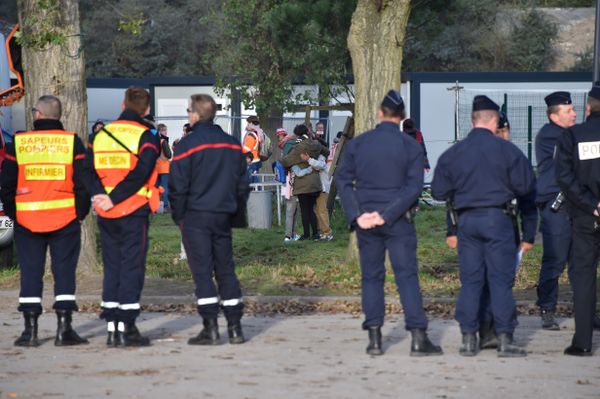 Migrant woman and children hug as they leave the Jules Ferry reception centre, next to the recently demolished Jungle migrant camp after a massive operation to clear the settlement, on November 3, 2016, in Calais Migrant woman and children hug as they leave the Jules Ferry reception centre, next to the recently demolished Jungle migrant camp after a massive operation to clear the settlement, on November 3, 2016, in Calais - Sputnik International