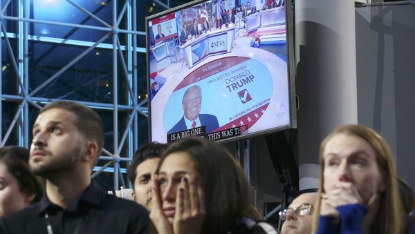 Supporters of Democratic presidential nominee Hillary Clinton watch and wait, with a Donald Trump image on a screen at rear, at her election night rally in New York, U.S., November 8, 2016 Supporters of Democratic presidential nominee Hillary Clinton watch and wait, with a Donald Trump image on a screen at rear, at her election night rally in New York, U.S., November 8, 2016 - Sputnik International