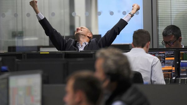 A trader stretches at BGC Partners after Donald Trump won the U.S. Presidential election, in London, Britain, November 9, 2016 - Sputnik International