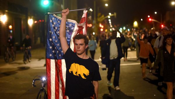 Protesters against president-elect Donald Trump march through Oakland, California, U.S., November 9, 2016 Protesters against president-elect Donald Trump march through Oakland, California, U.S., November 9, 2016 - Sputnik International