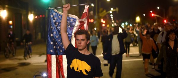Protesters against president-elect Donald Trump march through Oakland, California, U.S., November 9, 2016 Protesters against president-elect Donald Trump march through Oakland, California, U.S., November 9, 2016 - Sputnik International
