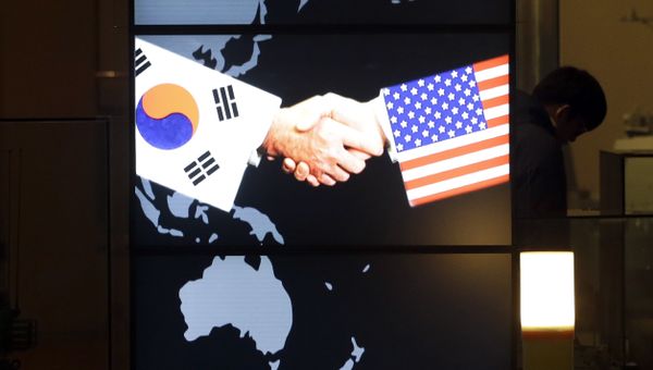 A visitor tour near the screen showing an image of a handshake by the U.S. and South Korean flags at the two countries' security alliance exhibition hall at the Korea War Memorial Museum in Seoul, South Korea, Wednesday, Jan. 14, 2015 A visitor tour near the screen showing an image of a handshake by the U.S. and South Korean flags at the two countries' security alliance exhibition hall at the Korea War Memorial Museum in Seoul, South Korea, Wednesday, Jan. 14, 2015 - Sputnik International