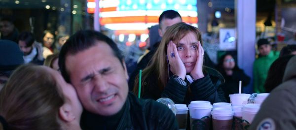 Supporters of Democratic candidate Hillary Clinton on Times Square in New York follow the preliminary vote results - Sputnik International