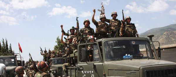 Syrian army soldiers standing on their military trucks chanting slogans in support of Syrian President Bashar Assad, as they enter a village near the town of Jisr al-Shughour, north of Damascus, Syria (File) - Sputnik International