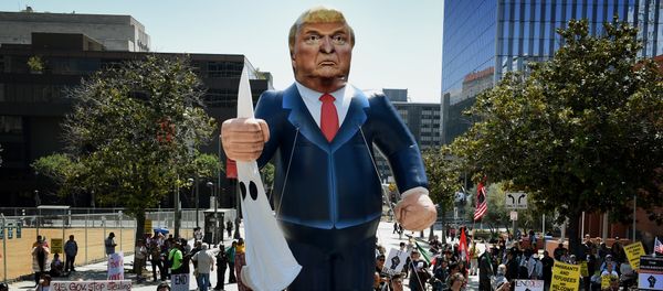 Members of the 'Full Rights for Immigrants Coalition' display a giant effigy of US Republican Party presidential hopeful Donald Trump during a protest on May Day in Los Angeles, California on May 1, 2016 Members of the 'Full Rights for Immigrants Coalition' display a giant effigy of US Republican Party presidential hopeful Donald Trump during a protest on May Day in Los Angeles, California on May 1, 2016 - Sputnik International