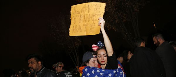 Supporters of Democratic presidential candidate Hillary Clinton react outside the White House early November 9, 2016 in Washington, DC - Sputnik International