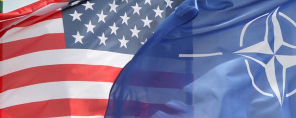 The US and The NATO flag flie in front of two US Air Force F-22 Raptor fighter aircrafts at the Air Base of the Lithuanian Armed Forces in Šiauliai, Lithuania, on April 27, 2016. The US and The NATO flag flie in front of two US Air Force F-22 Raptor fighter aircrafts at the Air Base of the Lithuanian Armed Forces in Šiauliai, Lithuania, on April 27, 2016. - Sputnik International