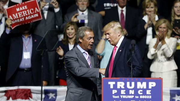 Republican presidential candidate Donald Trump welcomes Nigel Farage, left, ex-leader of the British UKIP party, to speak at a campaign rally in Jackson, Miss., Wednesday, Aug. 24, 2016. Republican presidential candidate Donald Trump welcomes Nigel Farage, left, ex-leader of the British UKIP party, to speak at a campaign rally in Jackson, Miss., Wednesday, Aug. 24, 2016. - Sputnik International