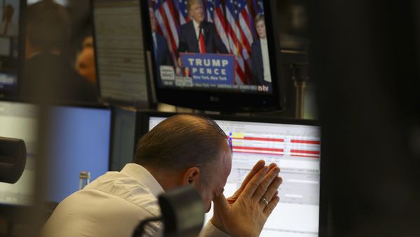 A trader at the stock exchange reacts in Frankfurt, Germany. - Sputnik International