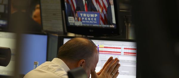 A trader at the stock exchange reacts in Frankfurt, Germany. - Sputnik International