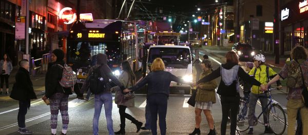 Protesters block a street and stop traffic during a demonstration against President-elect Donald Trump Protesters block a street and stop traffic during a demonstration against President-elect Donald Trump - Sputnik International