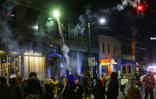 A protester sets off fireworks during a protest against President-elect Donald Trump, Wednesday, Nov. 9, 2016, in Seattle's Capitol Hill neighborhood. - Sputnik International