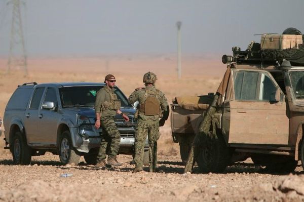 US soldiers stand near military vehicles, north of Raqqa city, Syria. File photo  - Sputnik International