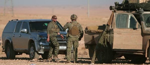 US soldiers stand near military vehicles, north of Raqqa city, Syria. File photo - Sputnik International