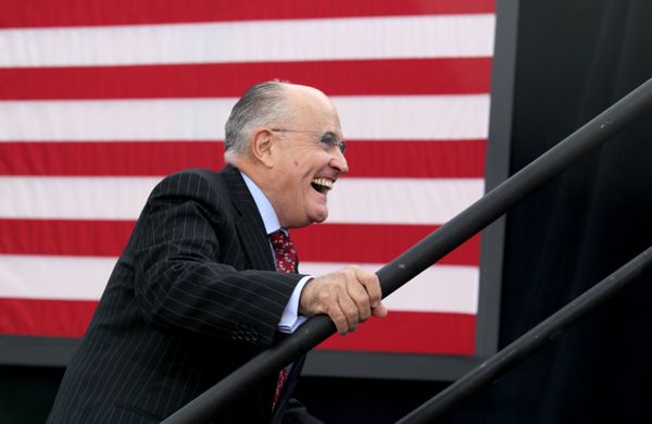 Former New York City mayor Rudy Giuliani smiles as he takes the stage to speak before Republican presidential candidate Donald Trump at an event on October 15, 2016 in Portsmouth, New Hampshire - Sputnik International
