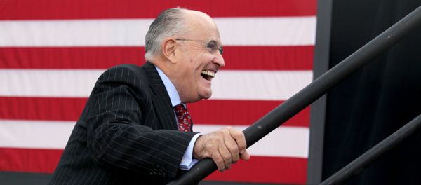 Former New York City mayor Rudy Giuliani smiles as he takes the stage to speak before Republican presidential candidate Donald Trump at an event on October 15, 2016 in Portsmouth, New Hampshire - Sputnik International