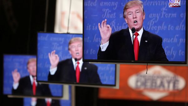 Donald Trump is shown on TV monitors in the media filing room on the campus of University of Nevada, Las Vegas, during the last 2016 U.S. presidential debate in Las Vegas, US, October 19, 2016. Donald Trump is shown on TV monitors in the media filing room on the campus of University of Nevada, Las Vegas, during the last 2016 U.S. presidential debate in Las Vegas, US, October 19, 2016. - Sputnik International