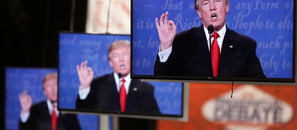Donald Trump is shown on TV monitors in the media filing room on the campus of University of Nevada, Las Vegas, during the last 2016 U.S. presidential debate in Las Vegas, US, October 19, 2016. - Sputnik International