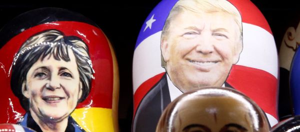Painted Matryoshka dolls, or Russian nesting dolls, bearing the faces of German Chancellor Angela Merkel an US President-elect Donald Trump Painted Matryoshka dolls, or Russian nesting dolls, bearing the faces of German Chancellor Angela Merkel an US President-elect Donald Trump - Sputnik International