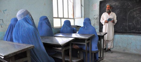 Afghan schoolgirls clad in burqas pay attention to their male teacher in the outskirts of Herat province on June 26, 2011 Afghan schoolgirls clad in burqas pay attention to their male teacher in the outskirts of Herat province on June 26, 2011 - Sputnik International