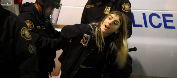 Police detain a demonstrator during a protest against the election of Republican Donald Trump as President of the United States in Portland, Oregon, U.S. November 10, 2016 - Sputnik International