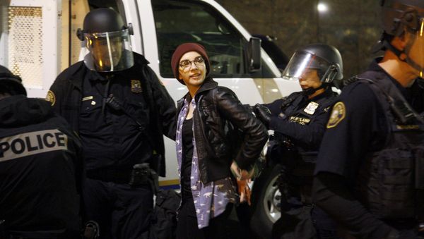 Police detain a demonstrator during a protest against the election of Republican Donald Trump as President of the United States in Portland, Oregon, U.S. November 10, 2016 Police detain a demonstrator during a protest against the election of Republican Donald Trump as President of the United States in Portland, Oregon, U.S. November 10, 2016 - Sputnik International