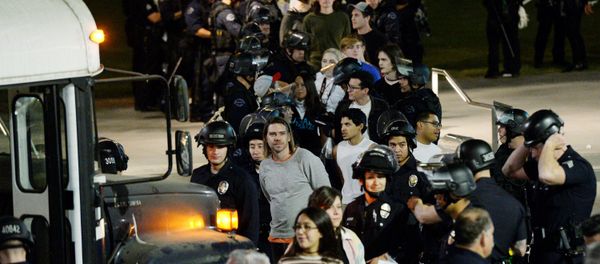 Protestors are detained by Los Angeles Police Department officers after a march and rally against the election of Republican Donald Trump as President of the United States in Los Angeles, California, U.S Protestors are detained by Los Angeles Police Department officers after a march and rally against the election of Republican Donald Trump as President of the United States in Los Angeles, California, U.S - Sputnik International