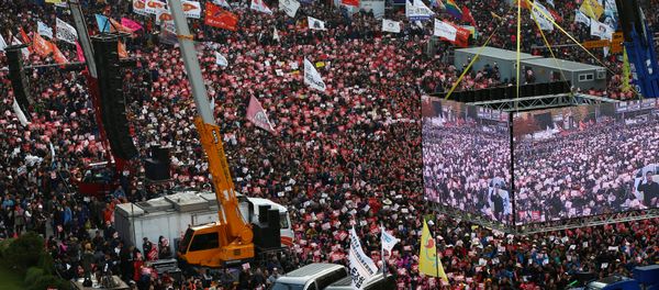 South Koreans shout slogans as they carry placards reading Park Geun-hye Out, during a protest against South Korean President Park Geun-Hye on a main street in Seoul, South Korea South Koreans shout slogans as they carry placards reading Park Geun-hye Out, during a protest against South Korean President Park Geun-Hye on a main street in Seoul, South Korea - Sputnik International