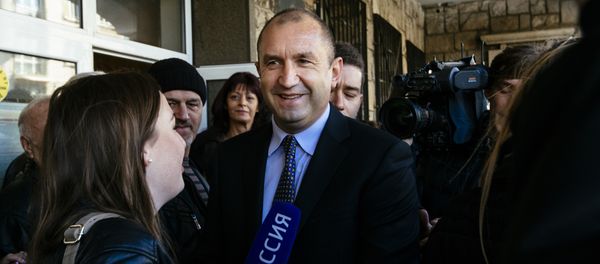 Former head of the Bulgarian airforce Rumen Radev, candidate of the opposition Socialists talks to the media after voting for the presidential elections at a polling station in Sofia Former head of the Bulgarian airforce Rumen Radev, candidate of the opposition Socialists talks to the media after voting for the presidential elections at a polling station in Sofia - Sputnik International