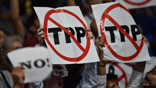 Delegates show their opposition to the Trans-Pacific Parternership Agreement (TPP) during Day 1 of the Democratic National Convention at the Wells Fargo Center in Philadelphia, Pennsylvania, July 25, 2016. Delegates show their opposition to the Trans-Pacific Parternership Agreement (TPP) during Day 1 of the Democratic National Convention at the Wells Fargo Center in Philadelphia, Pennsylvania, July 25, 2016. - Sputnik International