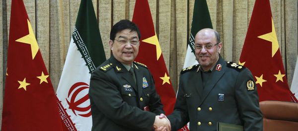 In this picture released by the Iranian Defense Ministry, Iranian Defense Minister Gen. Hossein Dehghan, right, and his Chinese counterpart Chang Wanquan shake hands after exchanging documents of an agreement in Tehran, Iran, Monday, Nov. 14, 2016. - Sputnik International