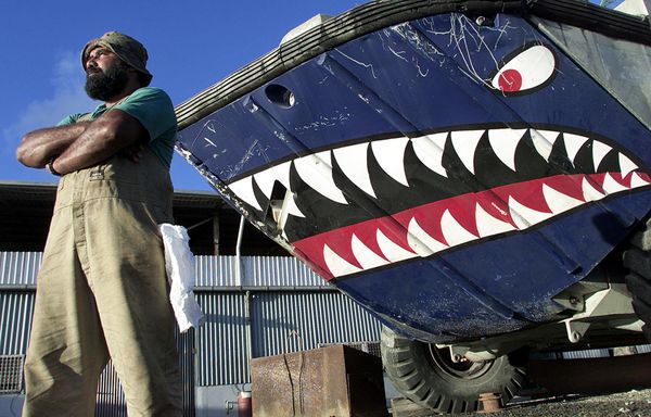 Qatia Brown, an engineer from Fiji, is one of several hundred migrant workers on the bankrupt island of Nauru, 14 September 2001, who have not received their wages for over a month.  - Sputnik International