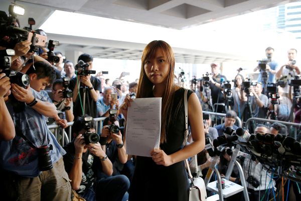 Democratically-elected legislators Yau Wai-ching holds the judgement as she leaves the High Court after court rules pro-independence lawmakers barred in Hong Kong, China November 15, 2016. Democratically-elected legislators Yau Wai-ching holds the judgement as she leaves the High Court after court rules pro-independence lawmakers barred in Hong Kong, China November 15, 2016. - Sputnik International
