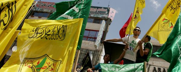 Palestinian supporters of Hamas Islamist movement and of Fatah party wave their faction's flags during a rally to support the Palestinian political unity deal, in the West Bank city of Jenin. (File) Palestinian supporters of Hamas Islamist movement and of Fatah party wave their faction's flags during a rally to support the Palestinian political unity deal, in the West Bank city of Jenin. (File) - Sputnik International