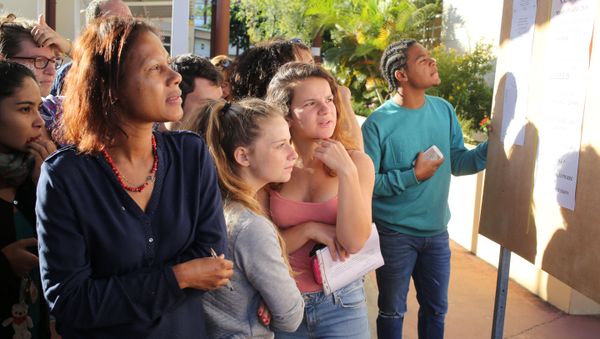 Students look at a board displaying the results of the baccalaureat exam (high school graduation exam) on July 5, 2016 at the Moulin Joli high school in La Possession, in the French overseas department of La Reunion Students look at a board displaying the results of the baccalaureat exam (high school graduation exam) on July 5, 2016 at the Moulin Joli high school in La Possession, in the French overseas department of La Reunion - Sputnik International