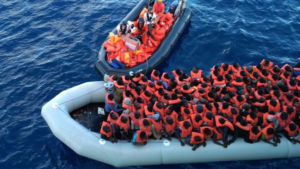 Migrants in a dinghy are rescued by the vessel Burbon Argos, run by Doctors Without Borders organization, in the Mediterranean sea, Friday, Nov. 4, 2016 Migrants in a dinghy are rescued by the vessel Burbon Argos, run by Doctors Without Borders organization, in the Mediterranean sea, Friday, Nov. 4, 2016 - Sputnik International