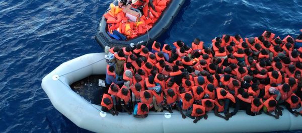 Migrants in a dinghy are rescued by the vessel Burbon Argos, run by Doctors Without Borders organization, in the Mediterranean sea, Friday, Nov. 4, 2016 - Sputnik International