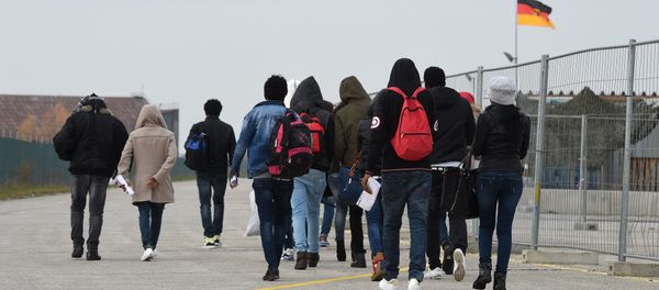 Migrants arrive at the first registration point for asylum seekers in Erding near Munich, southern Germany, on November 15, 2016 Migrants arrive at the first registration point for asylum seekers in Erding near Munich, southern Germany, on November 15, 2016 - Sputnik International