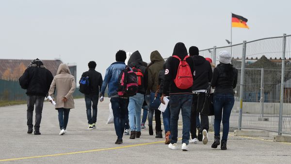 Migrants arrive at the first registration point for asylum seekers in Erding near Munich, southern Germany, on November 15, 2016 Migrants arrive at the first registration point for asylum seekers in Erding near Munich, southern Germany, on November 15, 2016 - Sputnik International