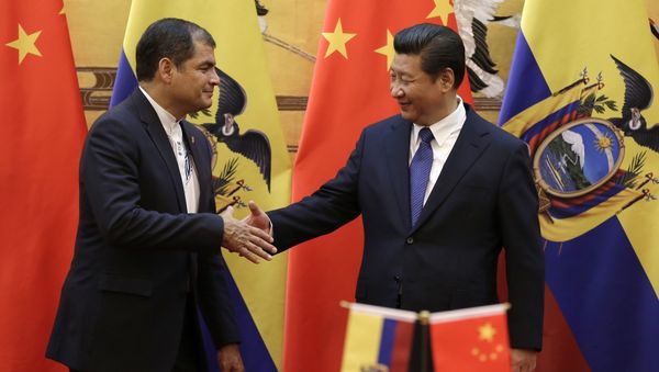 Chinese President Xi Jinping (R) shakes hands with Ecuador's President Rafael Correa after they witnessed a signing ceremony at the Great Hall of the People in Beijing (File) Chinese President Xi Jinping (R) shakes hands with Ecuador's President Rafael Correa after they witnessed a signing ceremony at the Great Hall of the People in Beijing (File) - Sputnik International