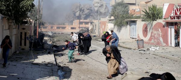 People run in panic after a coalition airstrike hit Islamic State fighters positions in Tahrir neighbourhood of Mosul, Iraq, November 17, 2016 People run in panic after a coalition airstrike hit Islamic State fighters positions in Tahrir neighbourhood of Mosul, Iraq, November 17, 2016 - Sputnik International