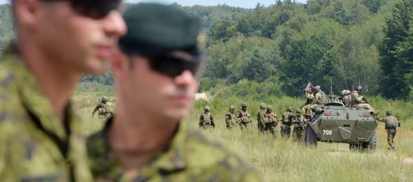 Canadian military instructors look on during Ukrainian military exercises at the International Peacekeeping and Security Center in Yavoriv, near Lviv(File) Canadian military instructors look on during Ukrainian military exercises at the International Peacekeeping and Security Center in Yavoriv, near Lviv(File) - Sputnik International