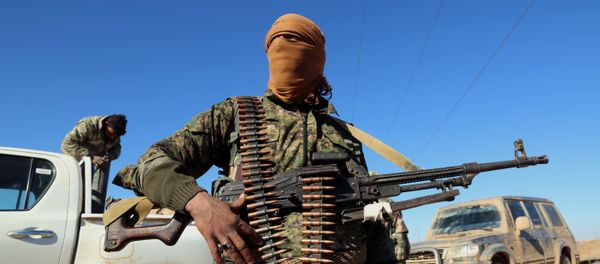 A fighter from the Kurdish-Arab alliance, known as the Syrian Democratic Forces on Raqa, advances in the village of Tall as Samn, near the front line north of the Islamic State (IS) group bastion, on November 17, 2016 A fighter from the Kurdish-Arab alliance, known as the Syrian Democratic Forces on Raqa, advances in the village of Tall as Samn, near the front line north of the Islamic State (IS) group bastion, on November 17, 2016 - Sputnik International