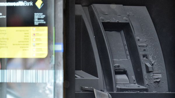 An electronic cash machine is burned at a branch of the Commonwealth Bank after a fire injured customers in Melbourne, Australia November 18, 2016 An electronic cash machine is burned at a branch of the Commonwealth Bank after a fire injured customers in Melbourne, Australia November 18, 2016 - Sputnik International