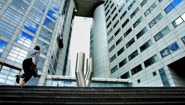 A woman walks up to the offices of the International Criminal Court (ICC) (File) A woman walks up to the offices of the International Criminal Court (ICC) (File) - Sputnik International