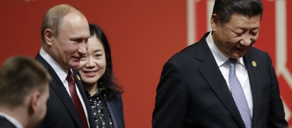 Russia's President Vladimir Putin, left, and China's President Xi Jinping, leave after a meeting with business leader during the annual Asia Pacific Economic Cooperation, APEC, Summit in Lima, Peru, Saturday, Nov. 19, 2016. Russia's President Vladimir Putin, left, and China's President Xi Jinping, leave after a meeting with business leader during the annual Asia Pacific Economic Cooperation, APEC, Summit in Lima, Peru, Saturday, Nov. 19, 2016. - Sputnik International